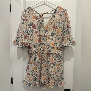 Size medium Sadie and Sage cream with flowers romper.